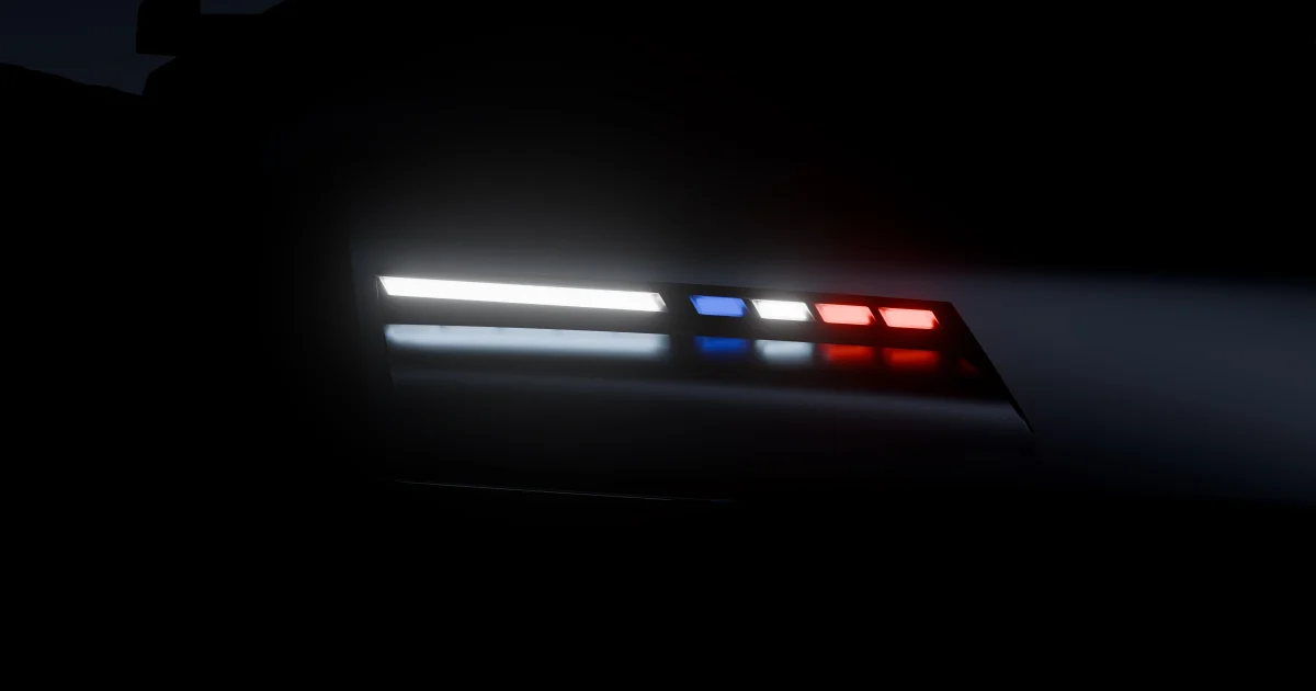 Oficiální teaser Alpine PS1 s detailem předního světlometu v bílé, modré a červené